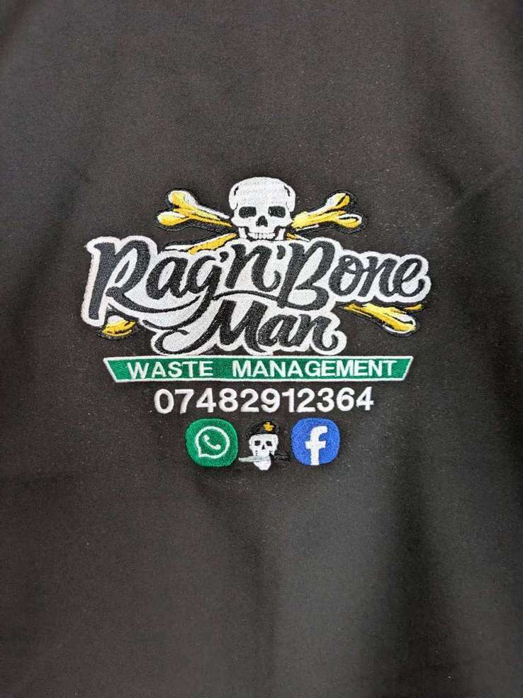 Close-up of dense, tightly stitched embroidered skull logo for Rag'n'Bone Man Waste Management