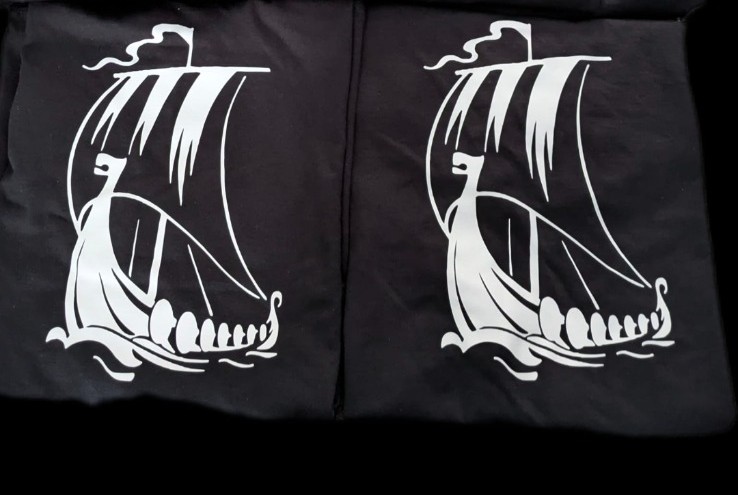 Large vinyl viking ship print on the back of Viking Bay Cafe staff t-shirts